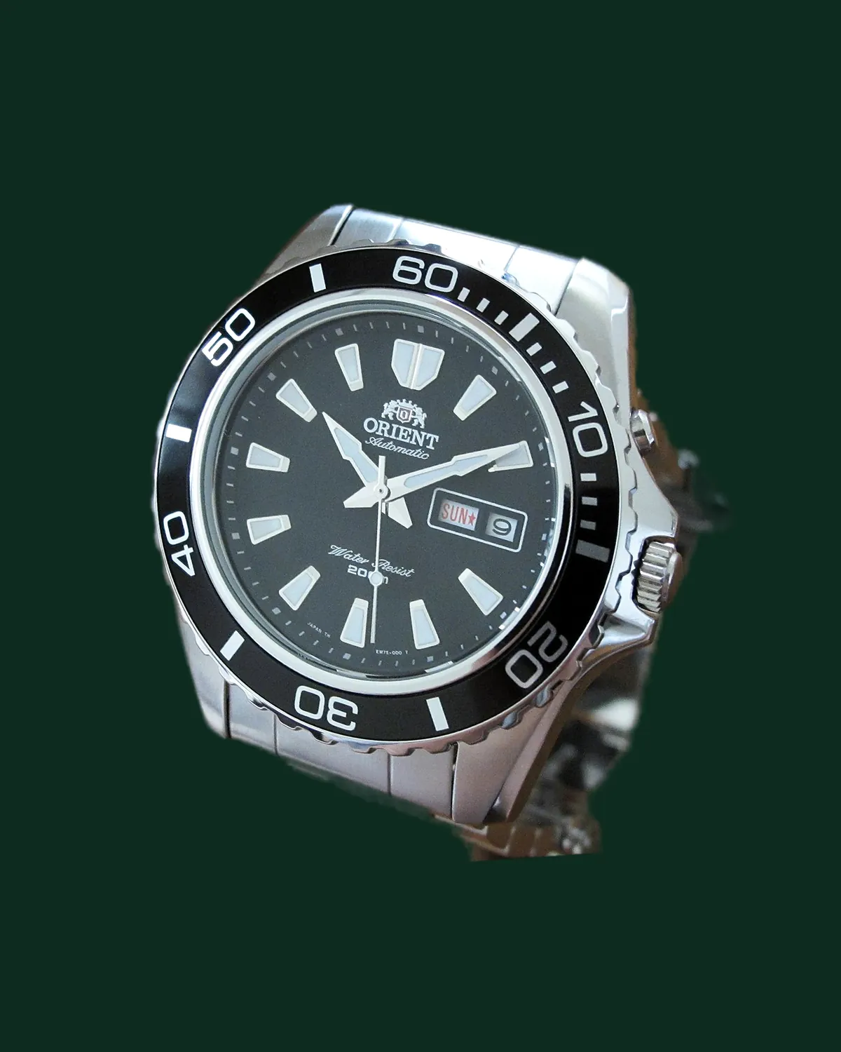 A dive watch with a black dial and a steel bracelet