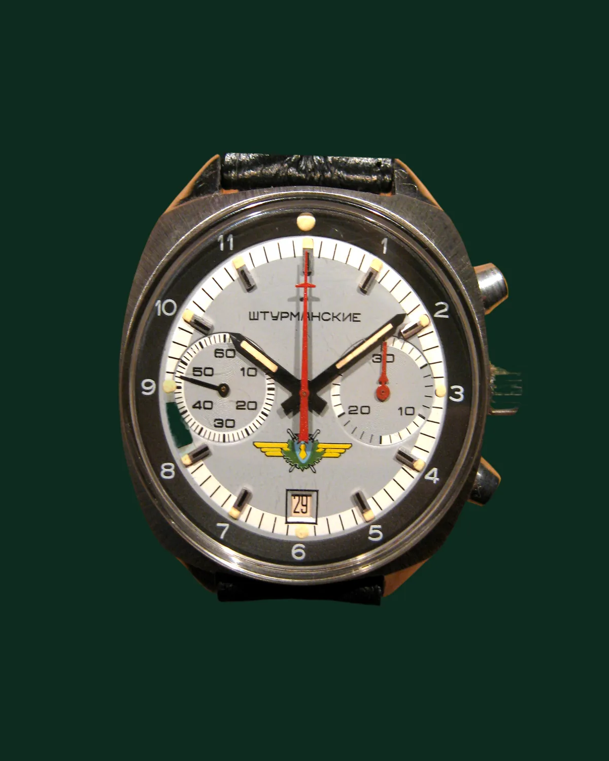 A chronograph with a cream dial and a leather strap